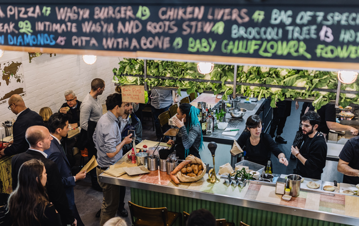 A busy restaurant with people lining up for some of the best middle eastern restaurant Melbourne food.